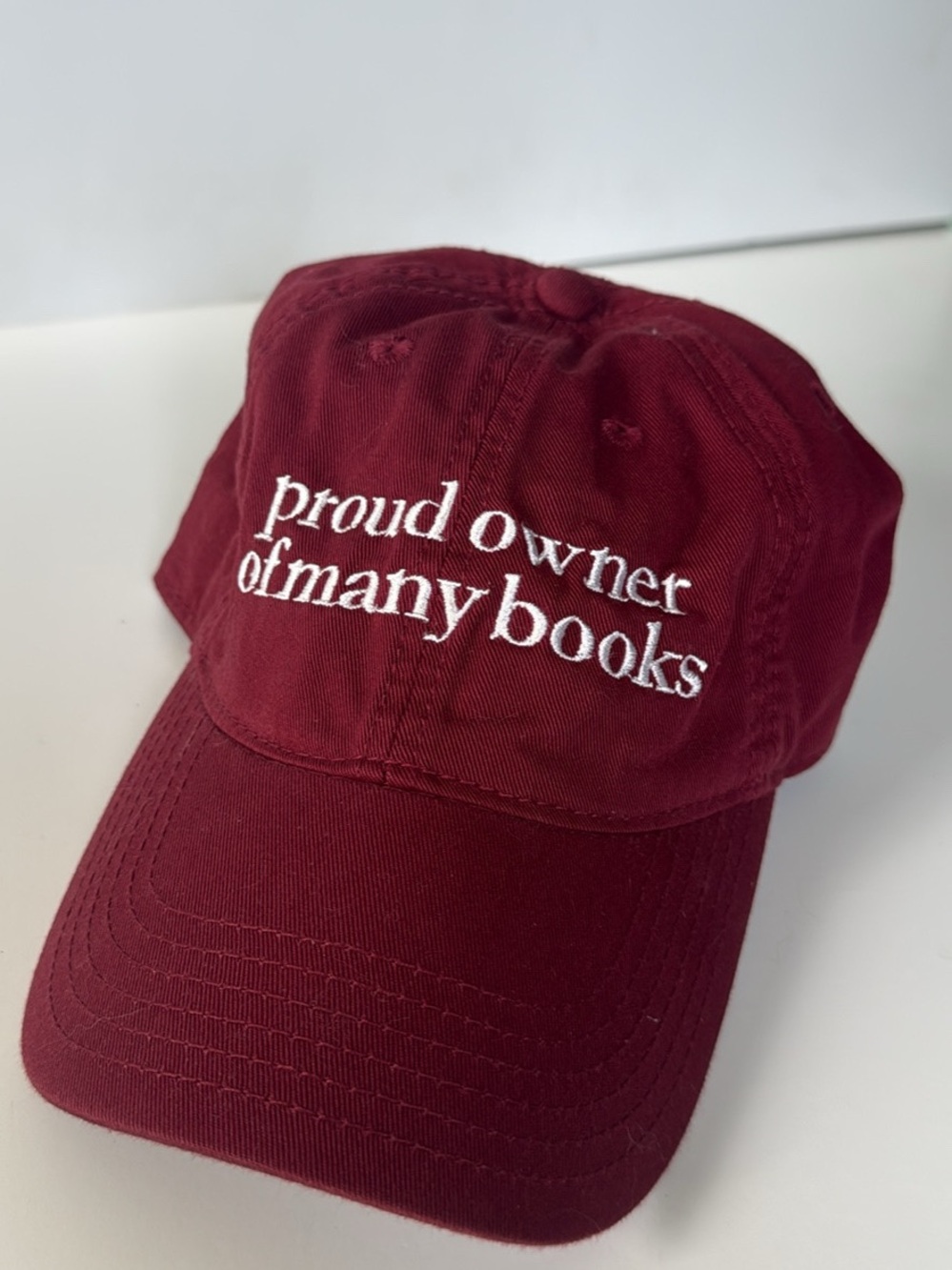 Maroon "Proud Owner of Many Books" Embroidered Cap